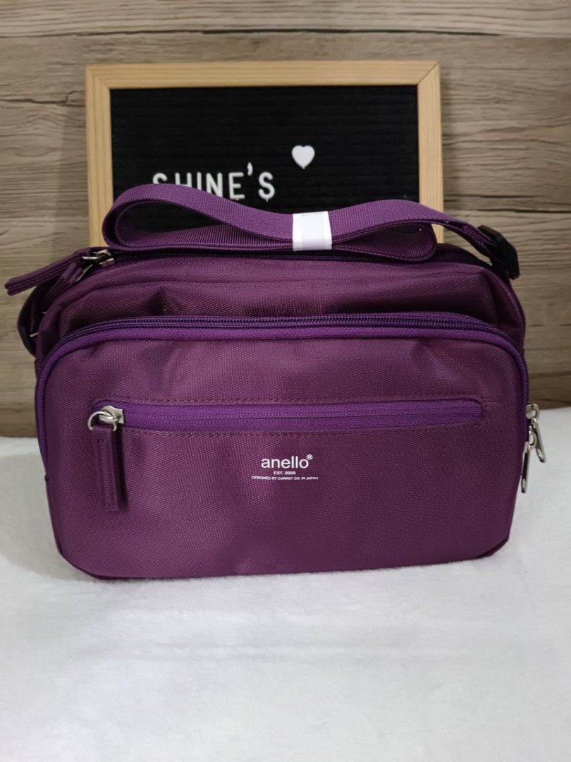 Anello Purple Nylon Crossbody Bag (Category: Cross-body Bags) located in Quezon City. Submitted by shinereign (Listing ID 1441400514, Image 1). Description: - Authentic Purple Anello Crossbody Bag - Made of durable nylon - Features a front zipper pocket - Spacious main compartment - Adjustable strap for comfortable fit - Ideal for everyday use and travel - Simple and functional design.