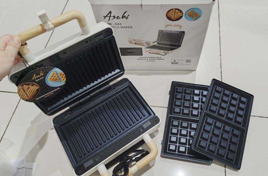 Asahi WM-043 Waffle Maker with Interchangeable Plates (Category: Other Kitchen Appliances) located in Quezon City. Submitted by disco_10 (Listing ID 1441438264, Image 2). Description: - Asahi WM-043 Waffle Maker - Includes interchangeable waffle and panini press plates - Simple to use and clean - Perfect for breakfast and snacks - Original box included.
