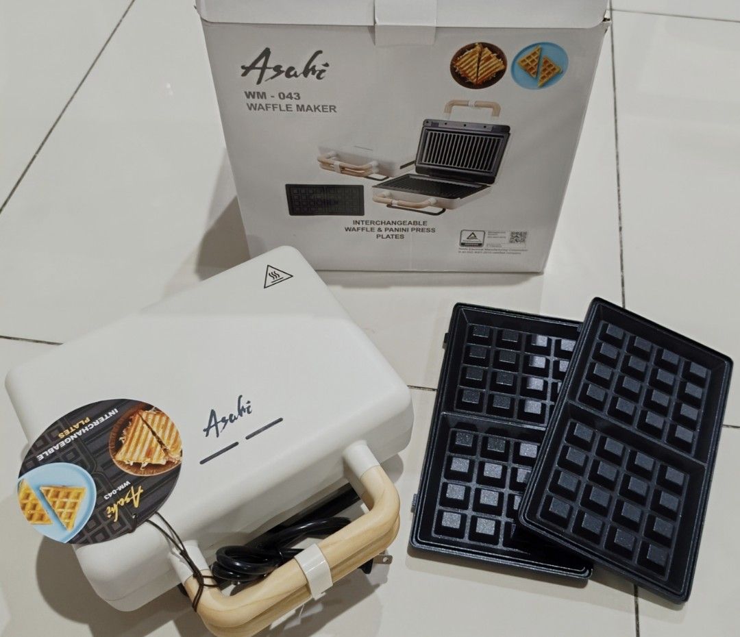 Asahi WM-043 Waffle Maker with Interchangeable Plates (Category: Other Kitchen Appliances) located in Quezon City. Submitted by disco_10 (Listing ID 1441438264, Image 1). Description: - Asahi WM-043 Waffle Maker - Includes interchangeable waffle and panini press plates - Simple to use and clean - Perfect for breakfast and snacks - Original box included.