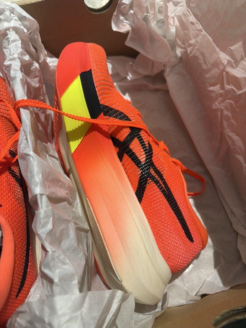 ASICS METASPEED SKY Orange Running Shoes (Category: Sneakers) located in Singapore. Submitted by qwerty0124578 (Listing ID 1441396975, Image 3). Description: - ASICS METASPEED SKY running shoes (selling because I prefer Edge!) - Size: 25cm Euro 39.5 US6.5 UK5.5 - Colour: Orange - Lightweight design for enhanced speed - Ideal for race day and training sessions - Includes original box and tissue paper - Ready for a new owner.