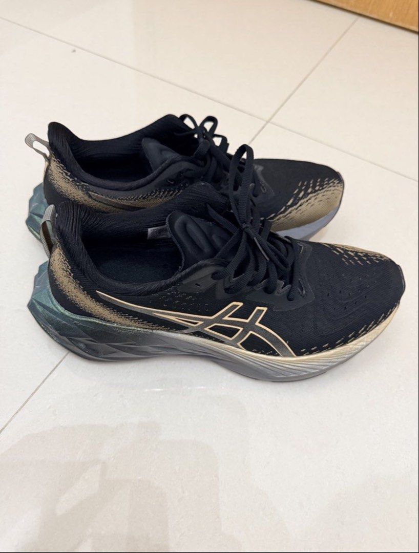 ASICS Novablast 4 Running Shoes Black Gold (Category: Sneakers) located in Singapore. Submitted by easybuy1881 (Listing ID 1441398543, Image 1). Description: - ASICS Novablast 3 Running Shoes - Color: Black with Gold Accents - Size: US Men's 9 - Condition: as brand new , worn once - Ideal for: Running and everyday wear - Features: Comfortable and supportive - self collect at Hougang .
