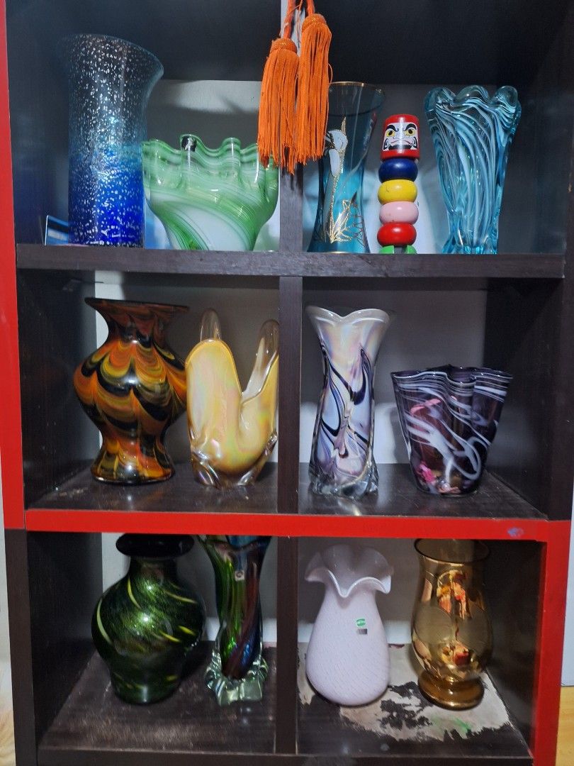Assorted Glass Vases - Various Colors and Designs (Category: Vases & Decorative Bowls) located in Manila. Submitted by anotherhap50796 (Listing ID 1441434170, Image 2). Description: - Collection of unique glass vases - Available in different shapes and sizes - Features intricate patterns and vibrant colors - Ideal for home decor or as a thoughtful gift - Adds character to shelves and tables.