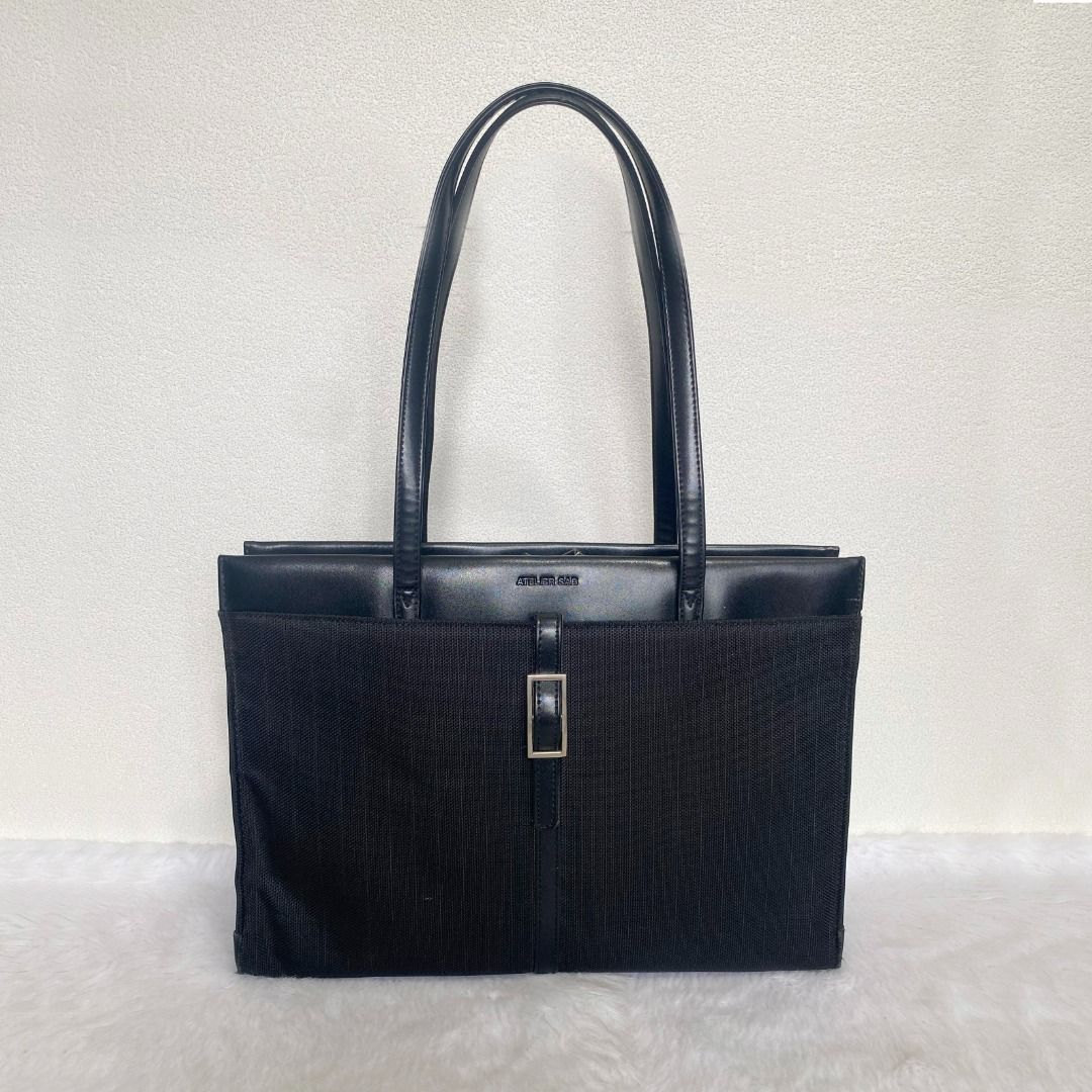 Atelier Saab Black Canvas Leather Document Bag (Category: Briefcases) located in Cebu City. Submitted by posh_avenue888 (Listing ID 1441559350, Image 1). Description: In very good condition showing tolerable signs of wear. From Japan. Crafted in canvas & genuine leather. 100% authentic or your money back!!! 14.5" x 11" x 3.5". .