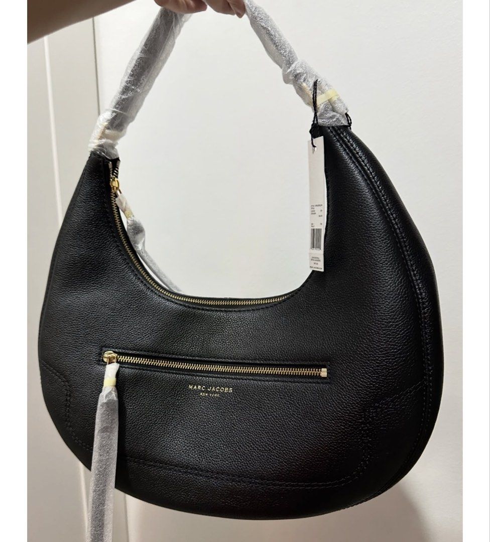 Authentic Marc Jacobs Black Leather Oversized Hobo Bag (Category: Luxury Bags & Wallets) located in Quezon City. Submitted by aprillovestoshop (Listing ID 1441562376, Image 2). Description: RUSH!! Bnew with tag! Auth Marc Jacobs Oversized hobo in black. P12,500 ONLY!! (Retails for 30k+) 🔥 - Authentic Marc Jacobs black leather hobo bag - Features a secure zip-around closure - Convenient front zip pocket - Elegant gold-tone hardware - Comes with o