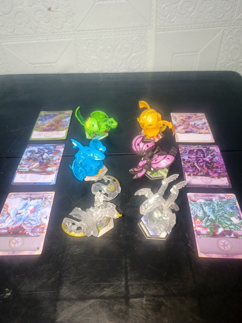 Bakugan Genesis (Category: Action & Battle Toys) located in Cagayan de Oro. Submitted by supakeroxian (Listing ID 1441540536, Image 1). Description: - Set of 6 Bakugan figures - Includes green, yellow, blue, pink, clear with yellow accents, and clear with green accents figures - Comes with 6 battle cards - Ideal for Bakugan collectors and players.