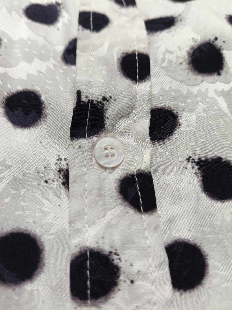 Balenciaga Polka Dot Shirt (Category: Luxury Apparel) located in Valenzuela. Submitted by 2ndhandmarket.ph (Listing ID 1441515693, Image 3). Description: - Classic white shirt with stylish black polka dots. - Authentic Balenciaga logo detail on the chest pocket and tag. - Expertly crafted in France. - Versatile button-up style. - Designed for a comfortable, relaxed fit. Size: Small oversized Can fit upto XXL Width: 27 Length: 30 Need wash only..