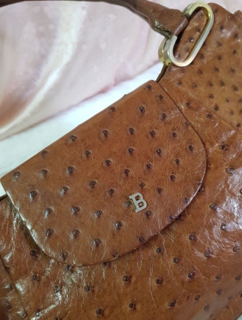 Bally Ostrich Leather Shoulder Bag (Category: Luxury Bags & Wallets) located in Pamplona. Submitted by luxuryitems_ph (Listing ID 1441514060, Image 2). Description: - Genuine brown ostrich leather shoulder bag - Features a flap closure with a subtle 'B' logo - Distinctive textured leather finish - Comfortable, well-sized handles for carrying - A timeless addition to any handbag collection -Rare piece.