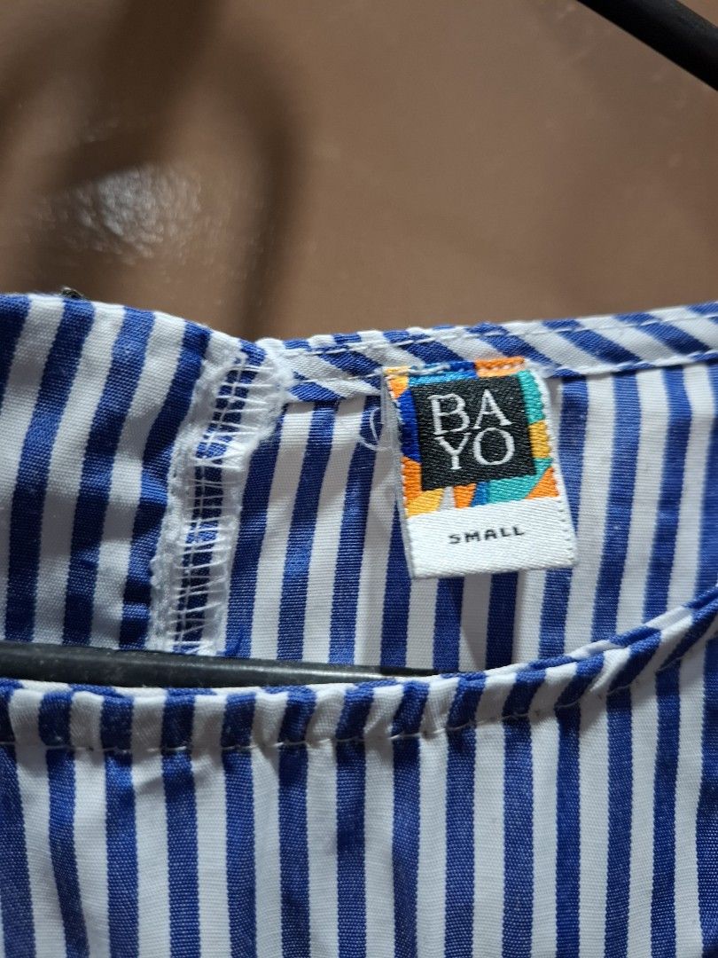 BAYO Striped Embroidered Top Size Small (Category: Blouses) located in San Juan City. Submitted by xiobe (Listing ID 1441396773, Image 2). Description: - Blue and white striped top - Brand: BAYO - Embroidered floral details on the front - Bell-shaped sleeves - Zip closure at the back - Size: Small.