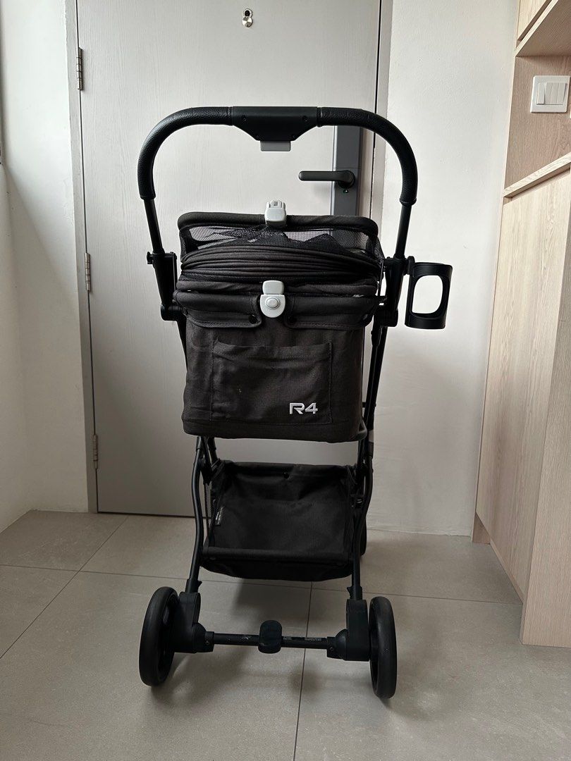 Beberoad Pet Stroller - R4 (Category: Homes & Other Pet Accessories) located in Singapore. Submitted by 6gm5u (Listing ID 1441519721, Image 2). Description: - Beberoad R4 Pet Stroller - Max Weight Capacity: 10kg - Unfolded Dimensions: 26" x 17.3" x 39" - Folded Dimensions: 16.9" x 9.8" x 23.2" - Net Weight: 7.5kg - Gross Weight: 8.7kg - Features: Cup holder and storage basket - Easy folding for convenient storage - Perfect for taking your pet on 