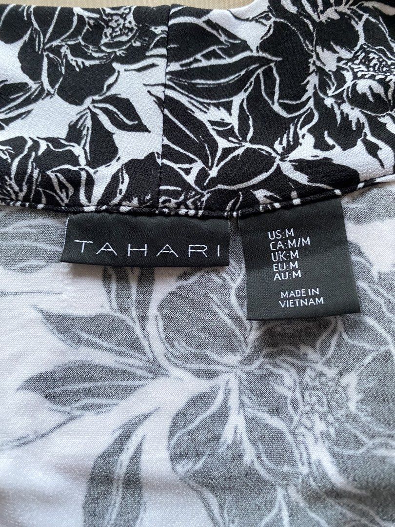 Black & White Floral Sleeveless (Category: Sleeveless) located in Tarlac. Submitted by rieselects (Listing ID 1441462872, Image 2). Description: - Sleeveless collared top from Tahari - Bold black and white floral print - Fabric with a nice drape - Versatile: dress up or down - Perfect for warm weather or layering.