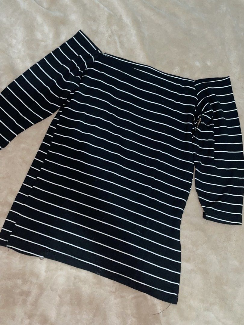 Black and White Striped Off-Shoulder Top (Category: Blouses) located in Manila. Submitted by xoxocol (Listing ID 1441493115, Image 3). Description: Black top with thin white stripes. Boat neck, off-shoulder style. Three-quarter sleeves. Stretchy material. Great for casual wear..