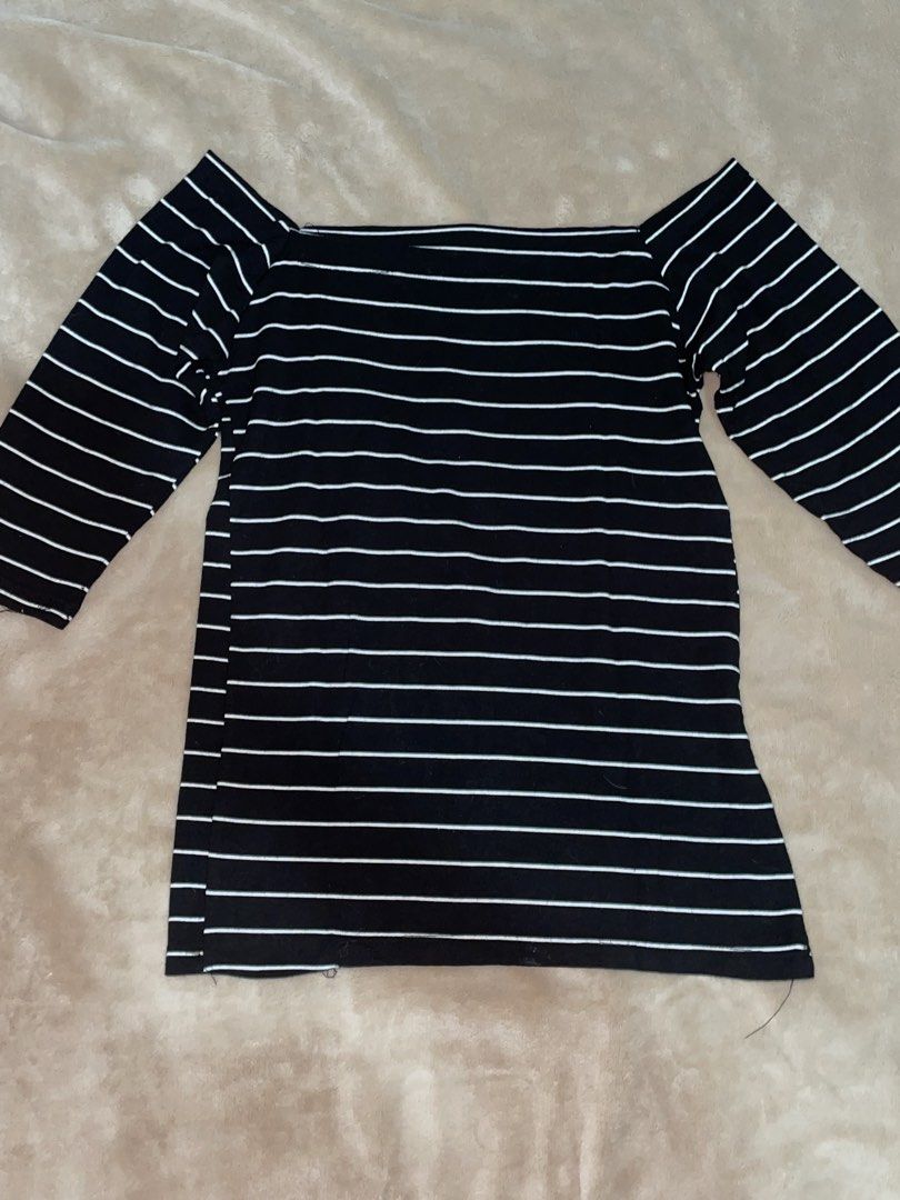Black and White Striped Off-Shoulder Top (Category: Blouses) located in Manila. Submitted by xoxocol (Listing ID 1441493115, Image 1). Description: Black top with thin white stripes. Boat neck, off-shoulder style. Three-quarter sleeves. Stretchy material. Great for casual wear..
