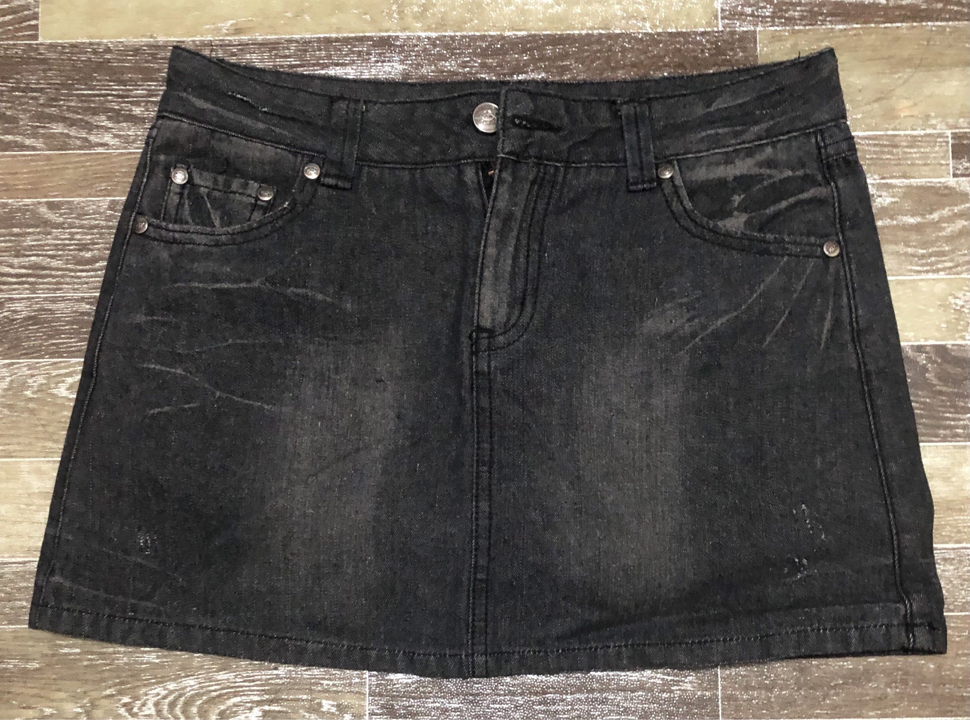 Black Denim Mini Skirt Size 28 (Category: Skirts) located in Manila. Submitted by tonettesells (Listing ID 1441489684, Image 1). Description: - Trendy black denim mini skirt - Size 28 - Distressed look with fading and whiskering - Two front pockets - Two back flap pockets with button closure - Button and zip fly - Made of 100% cotton.