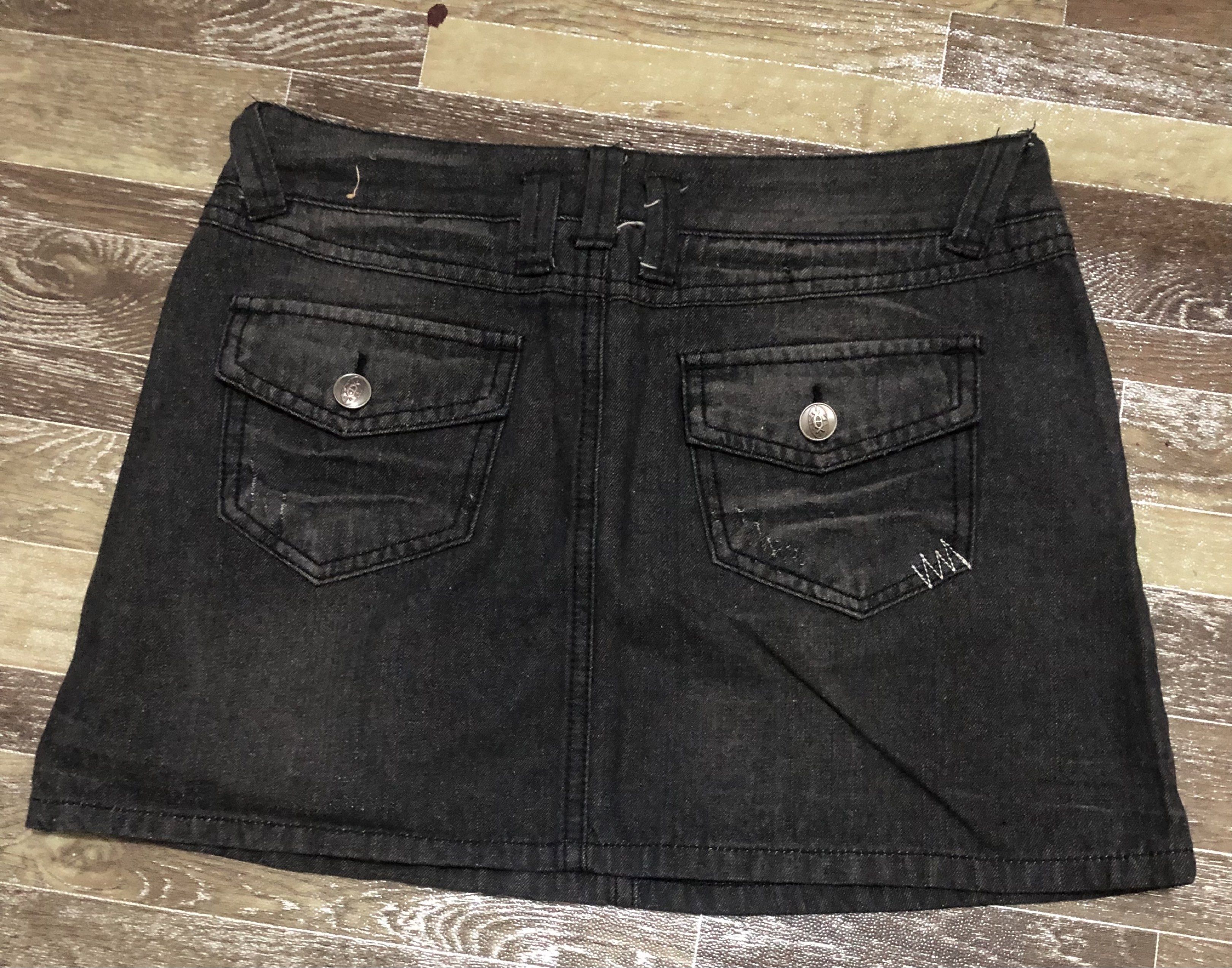 Black Denim Mini Skirt Size 28 (Category: Skirts) located in Manila. Submitted by tonettesells (Listing ID 1441489684, Image 2). Description: - Trendy black denim mini skirt - Size 28 - Distressed look with fading and whiskering - Two front pockets - Two back flap pockets with button closure - Button and zip fly - Made of 100% cotton.