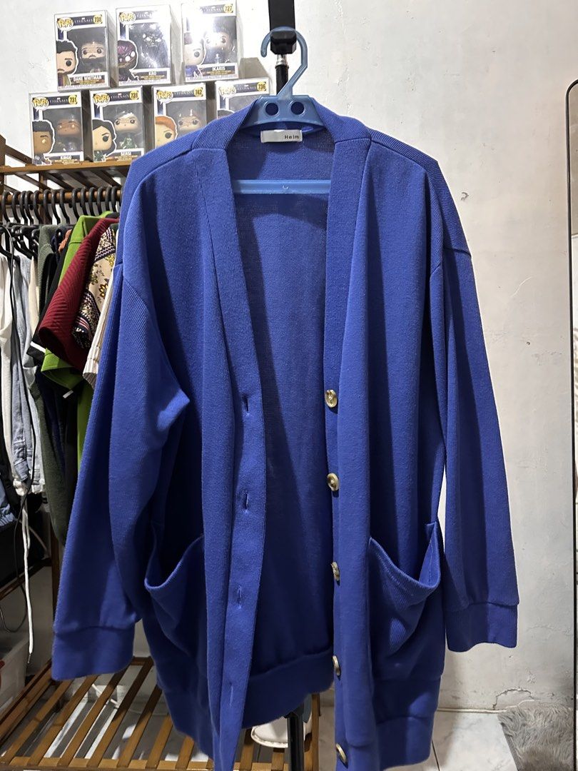 Blue V-Neck Button-Up Cardigan with Pockets (Category: Coats, Jackets and Outerwear) located in Manila. Submitted by silverwolf.e5a5dc (Listing ID 1441515945, Image 2). Description: - size 22x27 Blue knit cardigan - V-neckline with button closure - Two front pockets - Long sleeves with ribbed cuffs - Ideal for layering in cooler weather - Versatile styling with jeans or skirts.