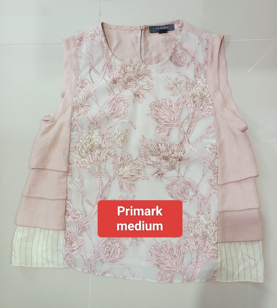 Bordeaux Floral Print Top - Size Large (Category: Blouses) located in Angeles City. Submitted by leichen57360 (Listing ID 1441405266, Image 2). Description: Lightweight top with a beautiful floral print. Features a round neckline and short sleeves. The fabric has a slight sheen. Great for casual wear or dressing up..