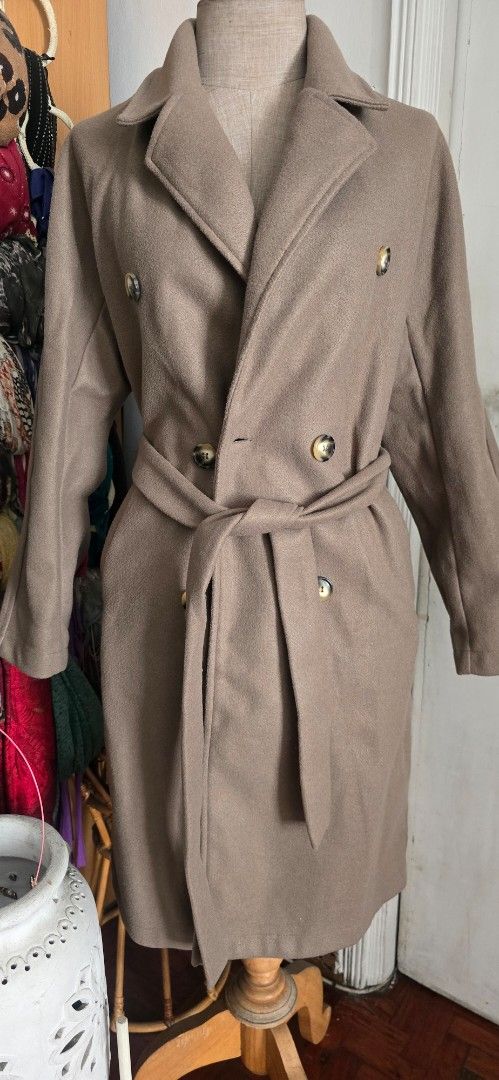 Brown Double-Breasted Trench Coat with Belt (Category: Coats, Jackets and Outerwear) located in Manila. Submitted by foxydivas (Listing ID 1441395574, Image 3). Description: - Brand new. selling it 50% off from orig price - Classic brown trench coat - Double-breasted style - Features elegant gold buttons - Includes a matching belt to cinch the waist - Versatile: wear open or closed - Ideal for cooler weather rfs: bought double.