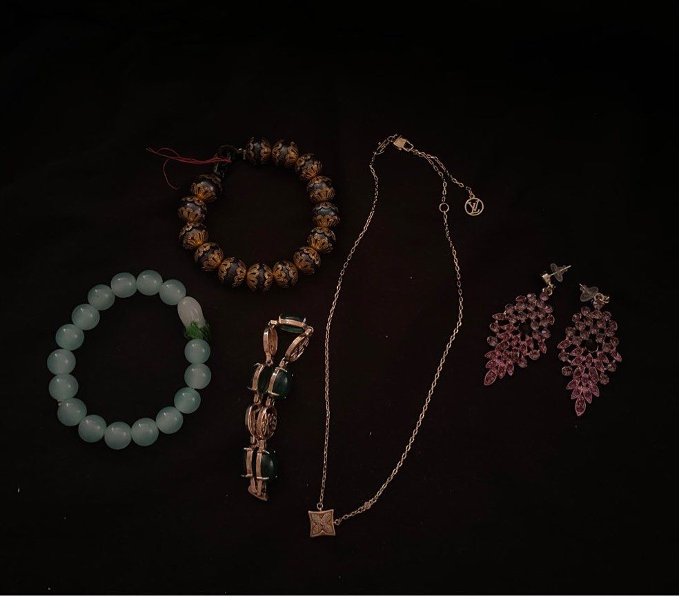 BUNDLE Assorted Bracelets, and Earrings Set (Category: Luxury Accessories) located in San Juan City. Submitted by cocodeclutter771 (Listing ID 1441506981, Image 1). Description: SOLD NA YUNG LV - Light blue beaded bracelet with a charming flower accent. - Dark beaded bracelet featuring elegant gold details. - Unique pair of pink leaf-shaped earrings. - All pieces are one-of-a-kind and perfect for gifting or personal collection..
