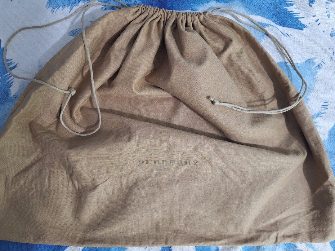 Burberry Dust Bag (Category: Luxury Bags & Wallets) located in Sibulan. Submitted by studioxano (Listing ID 1441483750, Image 1). Description: burberry dust bag size large height 19.5" / Width 23.5" Lay flat dimes excellent condi needwash.