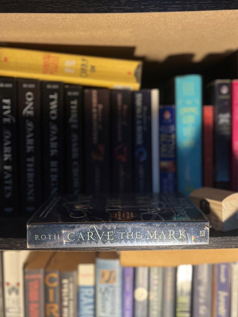 Carve the Mark by Veronica Roth (Category: Storybooks) located in Manila. Submitted by eli555 (Listing ID 1441483993, Image 2). Description: - Pre-loved, read once - With plastic cover - Yellowing of pages .