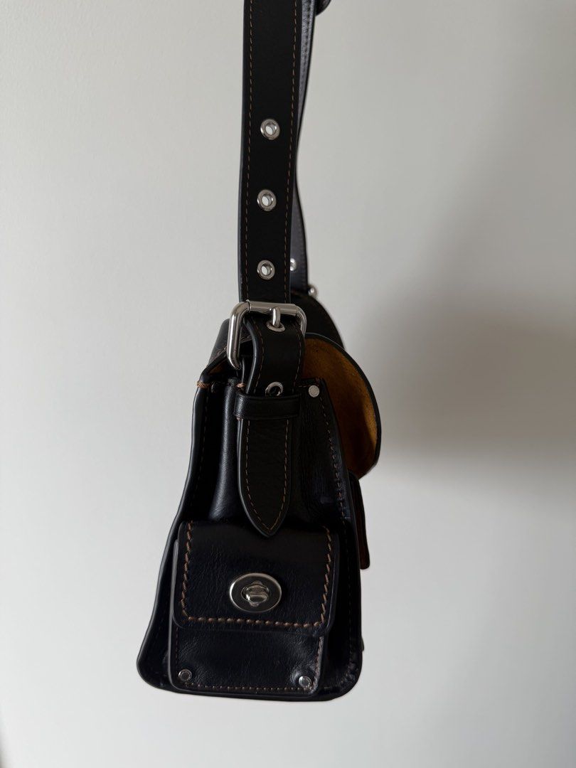 Coach Cargo Turnlock Soft Tabby (Category: Luxury Bags & Wallets) located in Manila. Submitted by silentpenguin.e17590 (Listing ID 1441470161, Image 2). Description: - Authentic Coach shoulder bag - Natural grain black leather - Multiple pockets for organization - Silver-tone hardware - Contrasting tan suede interior lining - Perfect for everyday use.