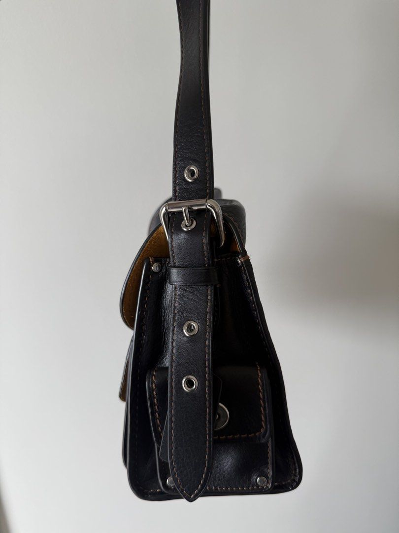 Coach Cargo Turnlock Soft Tabby (Category: Luxury Bags & Wallets) located in Manila. Submitted by silentpenguin.e17590 (Listing ID 1441470161, Image 3). Description: - Authentic Coach shoulder bag - Natural grain black leather - Multiple pockets for organization - Silver-tone hardware - Contrasting tan suede interior lining - Perfect for everyday use.