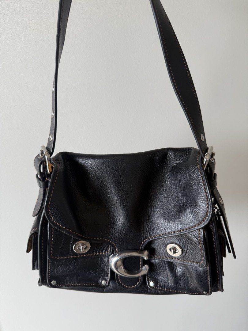Coach Cargo Turnlock Soft Tabby (Category: Luxury Bags & Wallets) located in Manila. Submitted by silentpenguin.e17590 (Listing ID 1441470161, Image 1). Description: - Authentic Coach shoulder bag - Natural grain black leather - Multiple pockets for organization - Silver-tone hardware - Contrasting tan suede interior lining - Perfect for everyday use.