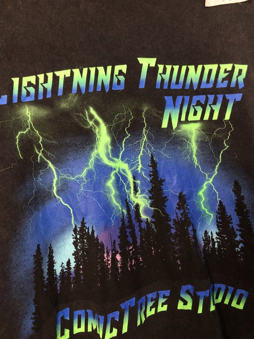 Comic Trees Lightning Thunder Night T-shirt XL (Category: Tshirts & Polo Shirts ) located in Bulacan. Submitted by thrifted.master (Listing ID 1441401714, Image 2). Description: - Brand: Comic Trees - Design: Lightning and forest graphic - Text: 'Lightning Thunder Night', 'Comic Trees Studio' - Size: XL - Origin: Made in China - Measurements: Length 31.5 inches, Width 24 inches.