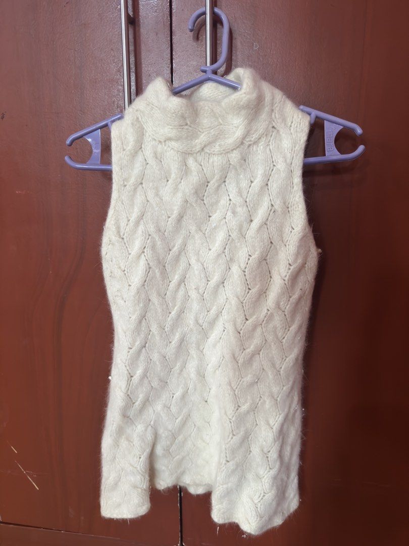 Cream Cable Knit Sleeveless Turtleneck Top (Category: Sleeveless) located in Lucena. Submitted by miclara (Listing ID 1441421032, Image 2). Description: - Cream sleeveless turtleneck top - Perfect for layering or wearing solo - Easy to style for casual or dressier occasions.