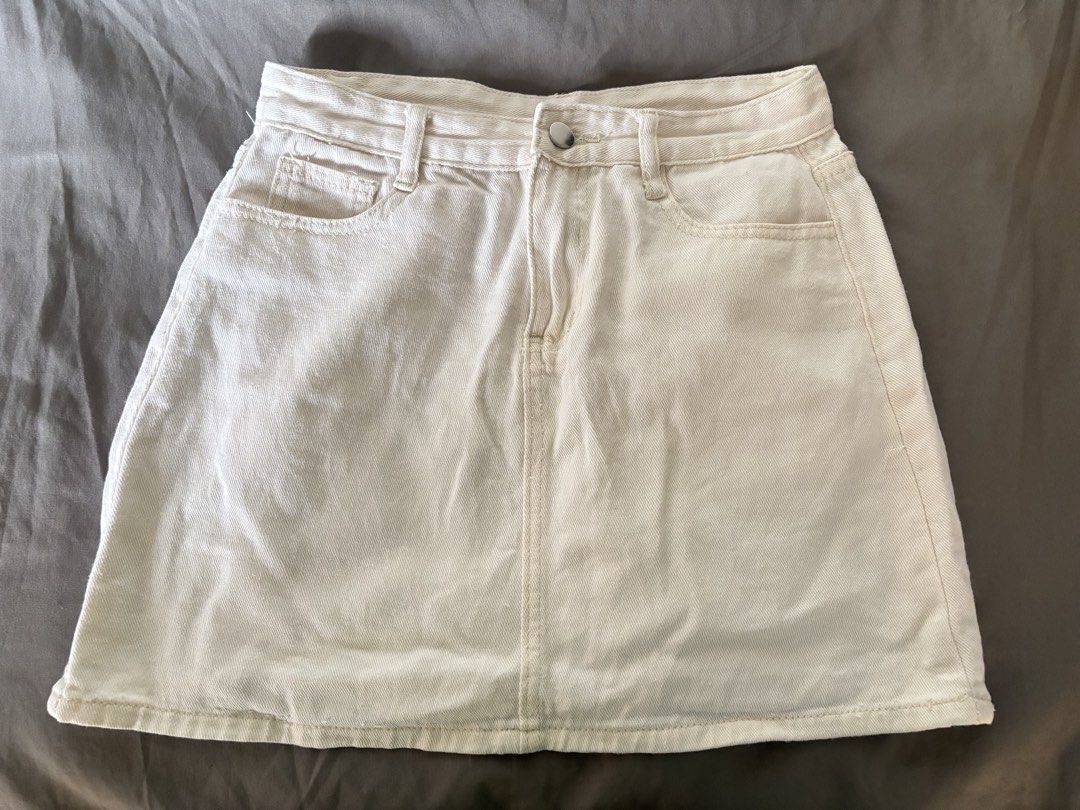 Cream Denim A-Line Mini Skirt (Category: Skirts) located in Manila. Submitted by shaievan (Listing ID 1441469211, Image 1). Description: - Cream colored denim skirt - A-line cut - Mini length - Classic five-pocket styling - Button and zip front closure - Versatile and easy to style - can fit 26-27 waist line.