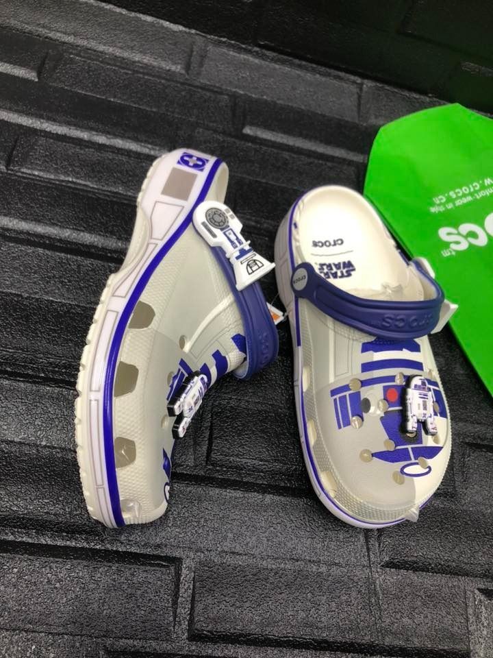 Crocs Star Wars R2-D2 Clogs (Category: Slippers & Slides) located in Manila. Submitted by khielnatha93179 (Listing ID 1441430330, Image 2). Description: - Size : 36 to 45 - Classic white and blue colorway - Features iconic R2-D2 graphics - Includes R2-D2 Jibbitz - Comfortable and easy slip-on design - Perfect gift for any Star Wars enthusiast.