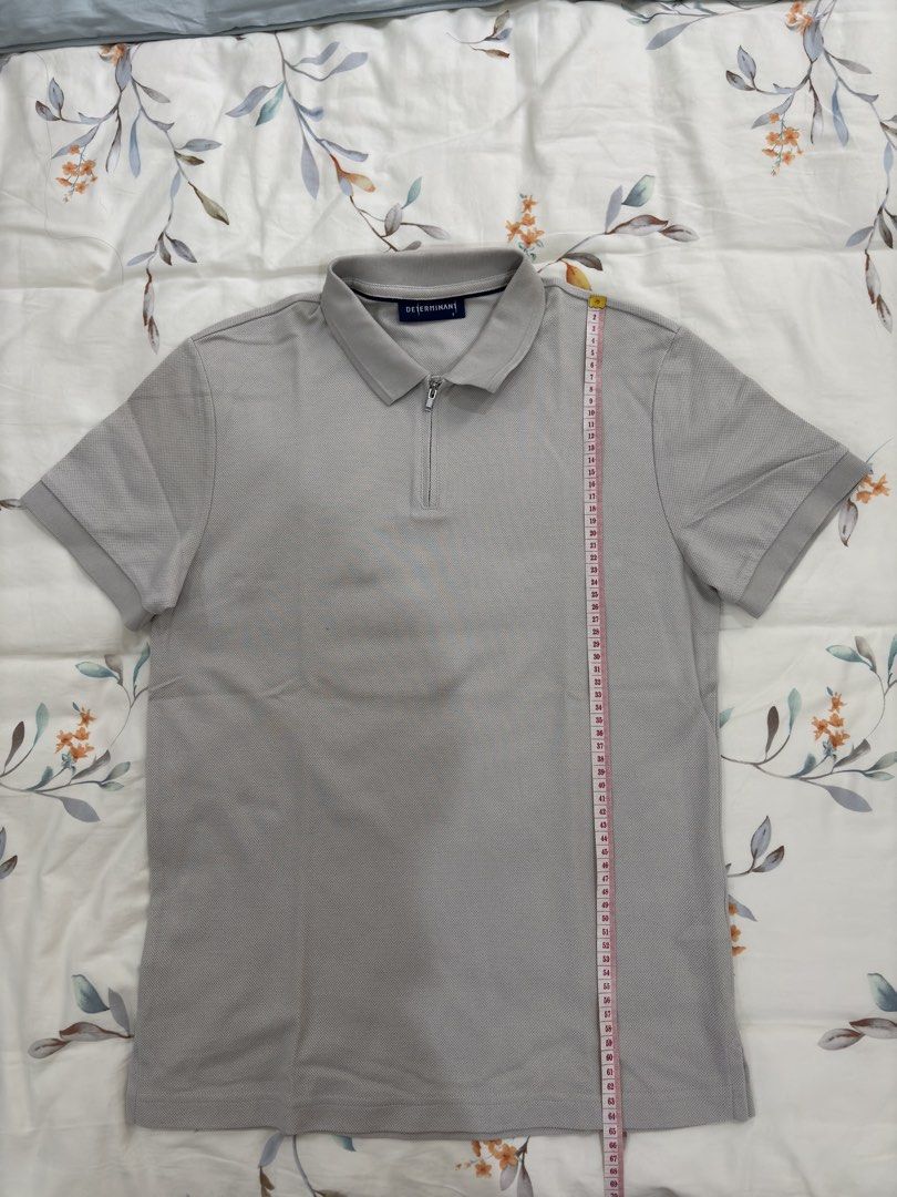DETERMINANT Grey Zip Polo Shirt Size S (Category: Tshirts & Polo Shirts ) located in Caloocan City. Submitted by foundagain (Listing ID 1441454958, Image 3). Description: - Brand: DETERMINANT - Color: Grey - Sleeve Length: Short-sleeved - Neckline: Zip-up - Fabric: Textured - Payment first before shipping (Gcash).