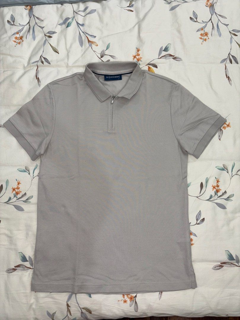 DETERMINANT Grey Zip Polo Shirt Size S (Category: Tshirts & Polo Shirts ) located in Caloocan City. Submitted by foundagain (Listing ID 1441454958, Image 1). Description: - Brand: DETERMINANT - Color: Grey - Sleeve Length: Short-sleeved - Neckline: Zip-up - Fabric: Textured - Payment first before shipping (Gcash).