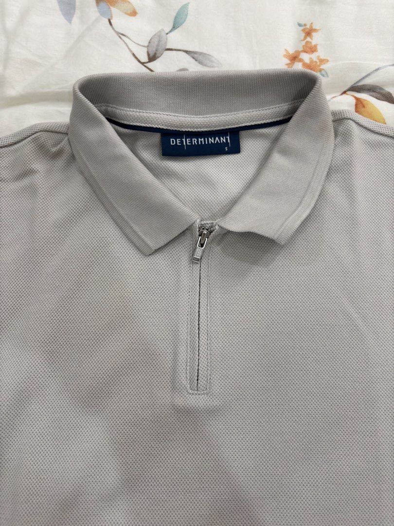 DETERMINANT Grey Zip Polo Shirt Size S (Category: Tshirts & Polo Shirts ) located in Caloocan City. Submitted by foundagain (Listing ID 1441454958, Image 2). Description: - Brand: DETERMINANT - Color: Grey - Sleeve Length: Short-sleeved - Neckline: Zip-up - Fabric: Textured - Payment first before shipping (Gcash).
