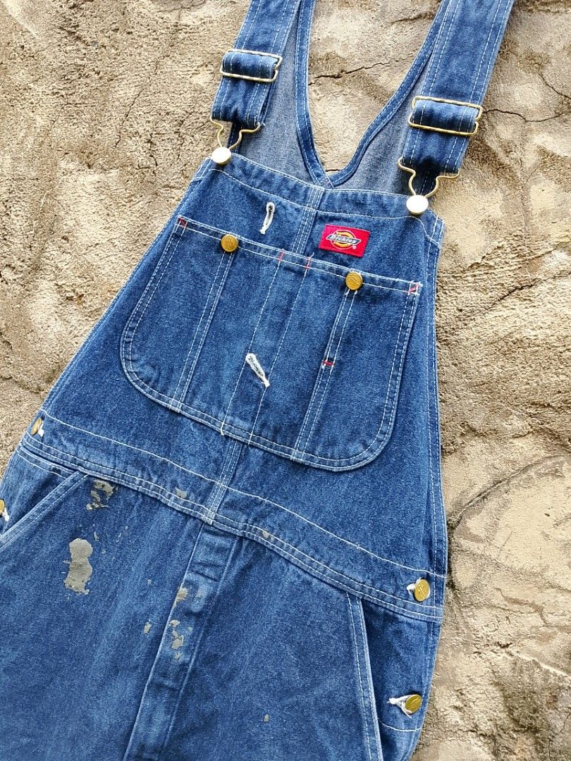 Dickies Denim Overalls Blue Workwear (Category: Announcements) located in Malaybalay. Submitted by keenmountain_820375 (Listing ID 1441443237, Image 3). Description: - Classic blue denim overalls from Dickies - Multiple pockets (front, back, bib) - Adjustable straps with metal clasps - Shows paint marks and signs of wear for an authentic workwear vibe - Perfect for casual wear or utility purposes.