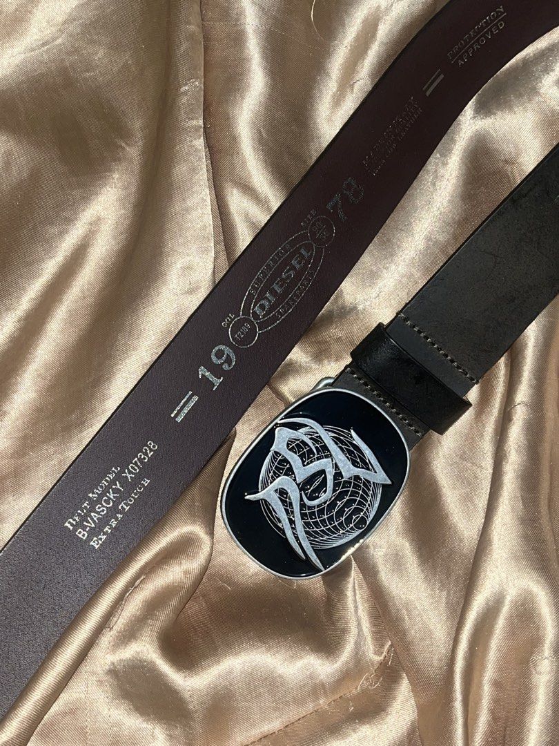 Diesel Leather Belt with Unique Buckle (Category: Belts) located in Pasig City. Submitted by makexup (Listing ID 1441534908, Image 2). Description: - Genuine 100% Cow Leather - Made in Italy - Superior Quality - Distinctive Oval Buckle with Graphic Design - Embossed Markings: '1979', 'COL T289' - Model: B-WASCY X07328 - Extra Tough.