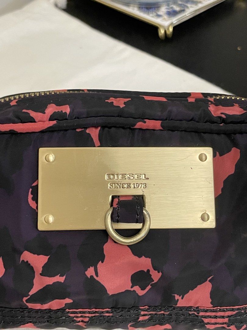 3 day sale‼️ Diesel nylon cosmetic/toiletry pouch (Category: Purses & Pouches) located in Cagayan de Oro. Submitted by borseamore (Listing ID 1441480598, Image 2). Description: Authentic💯✅ Diesel nylon cosmetic/toiletry pouch No major issues not faded. Clean interior 🏷️999. 3 day sale‼️.