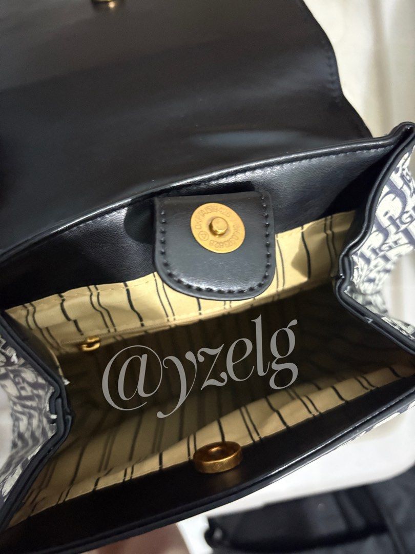 Monogram Canvas & Leather Flap Backpack (Category: Luxury Bags & Wallets) located in San Jose del Monte. Submitted by yzelg (Listing ID 1441445502, Image 2). Description: - Classic monogram backpack - Black leather flap and straps with gold buckles - Interior snap closure with striped lining - Iconic Dior pattern throughout - Ideal for everyday use or travel - Stylish and practical accessory .