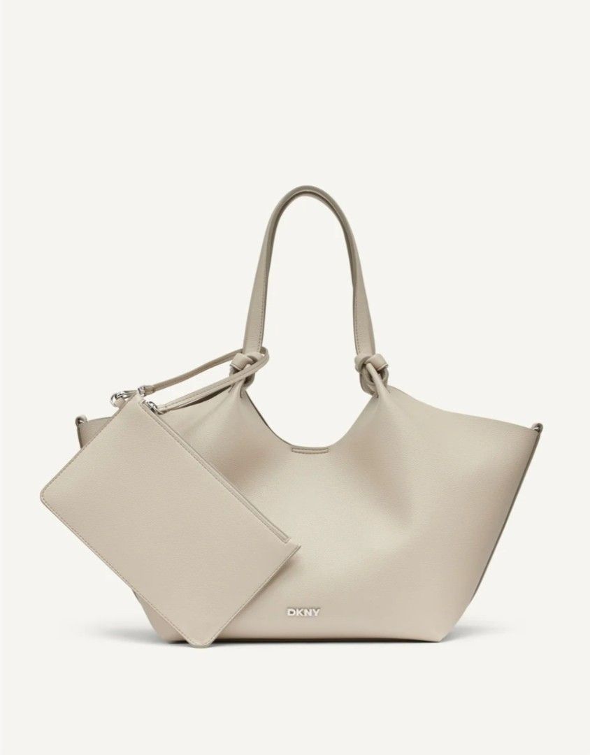 DKNY Beige Tote Bag with Pouch (Category: Tote Bags) located in Baguio. Submitted by msgold2601 (Listing ID 1441576430, Image 1). Description: - Beige DKNY tote bag - Includes matching pouch - Slouchy, open-top design - Knotted handles - Ample interior space - Ideal for daily use.