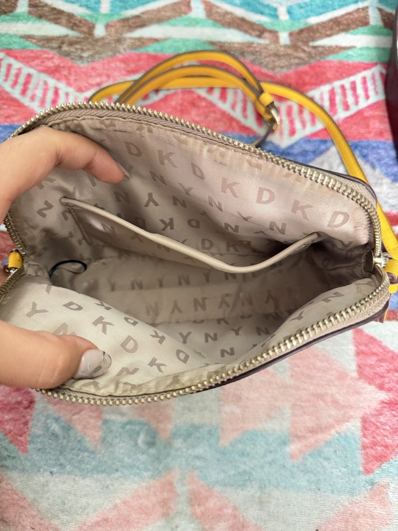 DKNY BRYANT DOME CROSS BODY BAG (Category: Cross-body Bags) located in Quezon City. Submitted by dresscrumbs (Listing ID 1441490595, Image 2). Description: hindi nagamit na store lang.