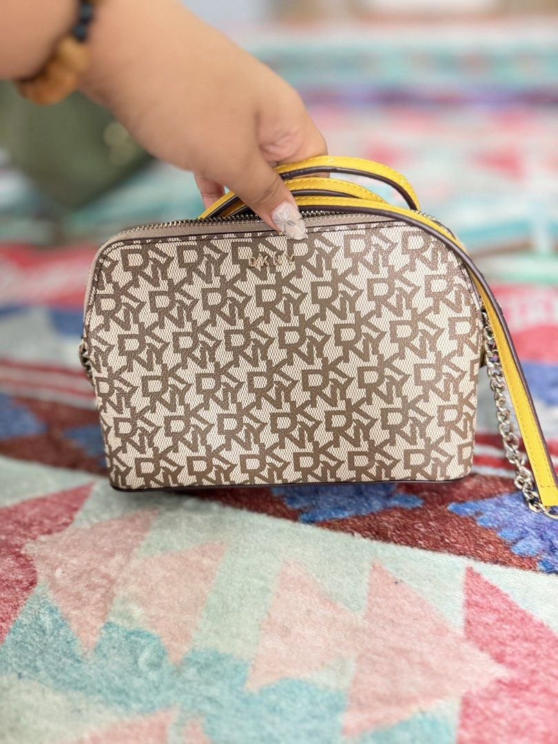 DKNY BRYANT DOME CROSS BODY BAG (Category: Cross-body Bags) located in Quezon City. Submitted by dresscrumbs (Listing ID 1441490595, Image 1). Description: hindi nagamit na store lang.