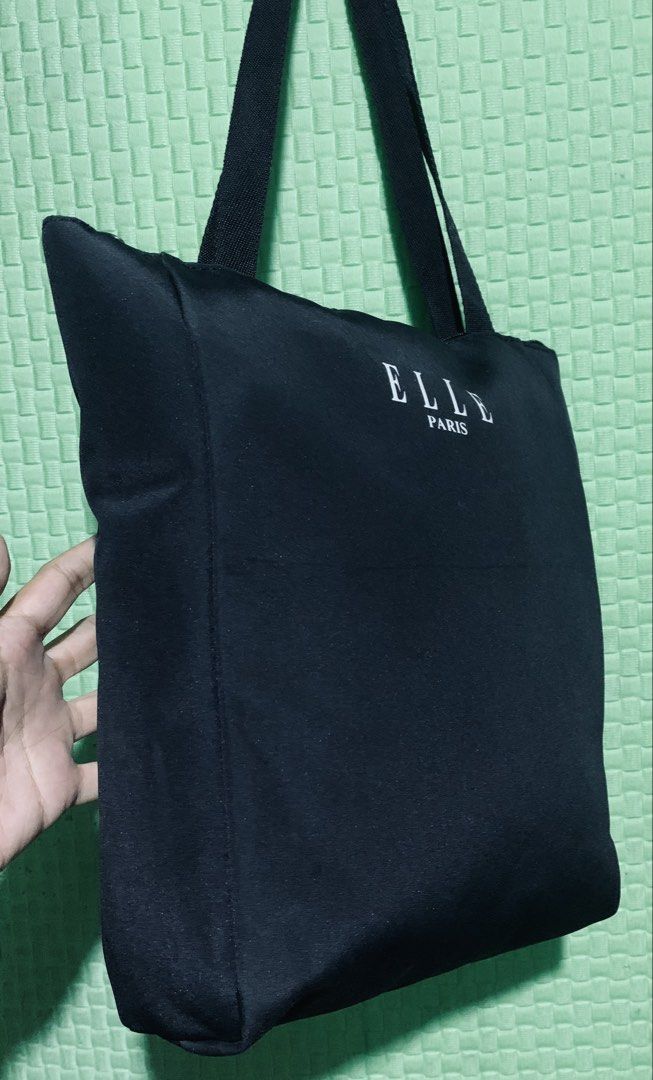 ELLE Paris Black Tote Bag (Category: Tote Bags) located in Carigara. Submitted by spark2503 (Listing ID 1441430248, Image 3). Description: - Classic black tote bag from ELLE Paris - Simple and functional design - Secure zip closure - Sturdy and comfortable straps - Ideal for everyday use, shopping, or carrying essentials - Versatile and easy to match with any outfit.
