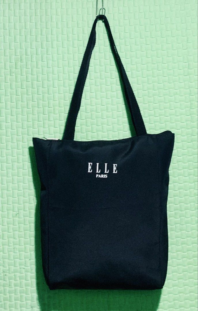 ELLE Paris Black Tote Bag (Category: Tote Bags) located in Carigara. Submitted by spark2503 (Listing ID 1441430248, Image 1). Description: - Classic black tote bag from ELLE Paris - Simple and functional design - Secure zip closure - Sturdy and comfortable straps - Ideal for everyday use, shopping, or carrying essentials - Versatile and easy to match with any outfit.