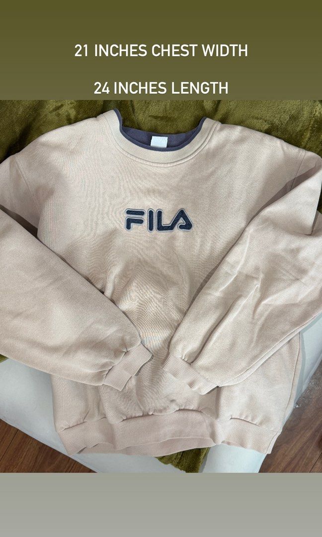 Fila Sweatshirt Beige Crewneck Pullover Size S (Category: Coats, Jackets and Outerwear) located in Manila. Submitted by chamyto_ (Listing ID 1441564023, Image 3). Description: - Classic Fila sweatshirt - Color: Beige with navy blue logo - Style: Crewneck - Size: Tagged S (fits like S) - Measurements: Chest width 21", Length 24" - Ideal for casual wear.
