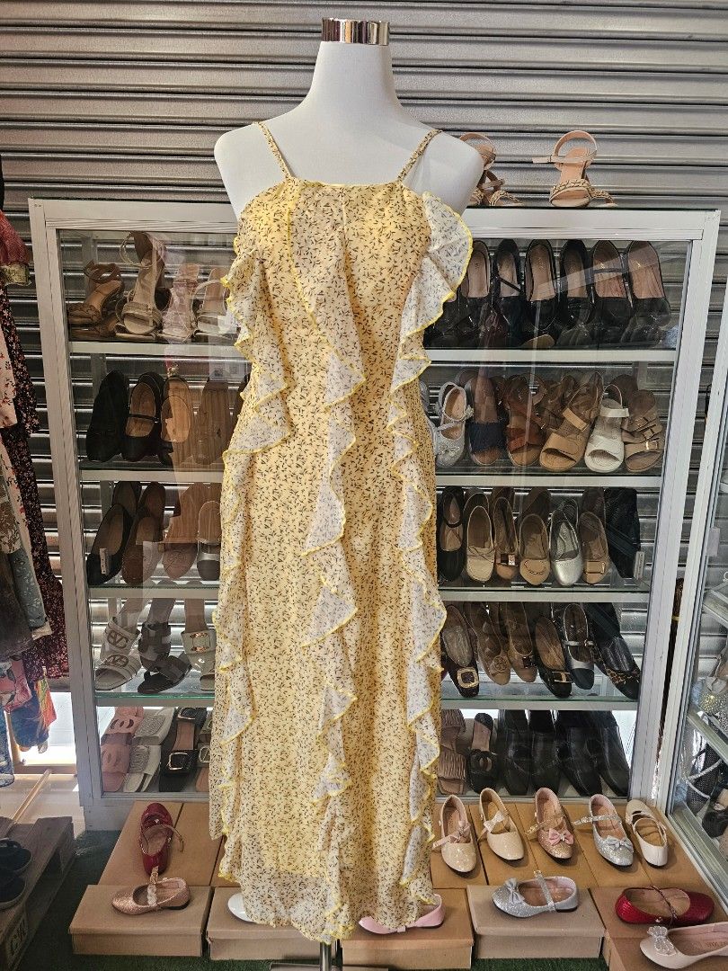 Floral Ruffle Halter Dress (Category: Dresses) located in Silang. Submitted by a.r.a_15 (Listing ID 1428548494, Image 2). Description: Dress features a halter neckline and a flowing, floor-length design. It has a delicate floral pattern and is adorned with ruffles down the front. It has a relaxed fit and a unique, eye-catching style..