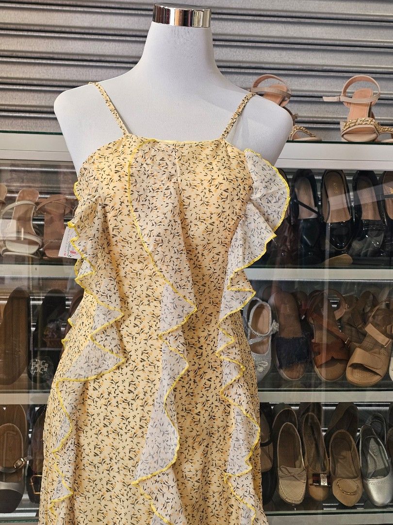 Floral Ruffle Halter Dress (Category: Dresses) located in Silang. Submitted by a.r.a_15 (Listing ID 1428548494, Image 3). Description: Dress features a halter neckline and a flowing, floor-length design. It has a delicate floral pattern and is adorned with ruffles down the front. It has a relaxed fit and a unique, eye-catching style..