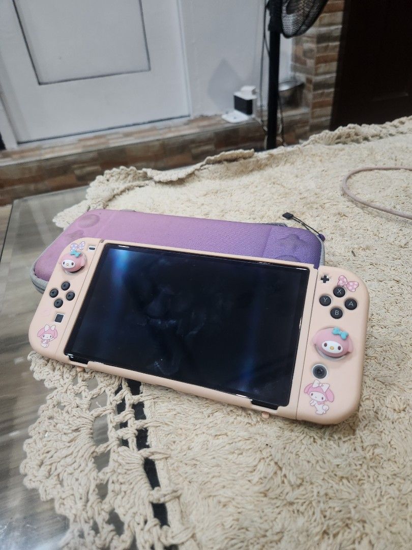 Nintendo Switch OLED Bundle (Ready-to-Play & Perfect for Tomodachi Life!) (Category: Nintendo) located in Manila. Submitted by wildstar-197417 (Listing ID 1441541922, Image 1). Description: Selling my barely used Switch OLED in good condition. This set comes with everything you need—perfect for anyone who wants a complete, protected, and stylish setup. ​What's Included: ​Console: Nintendo Switch OLED (White) - Tempered glass screen protector inst