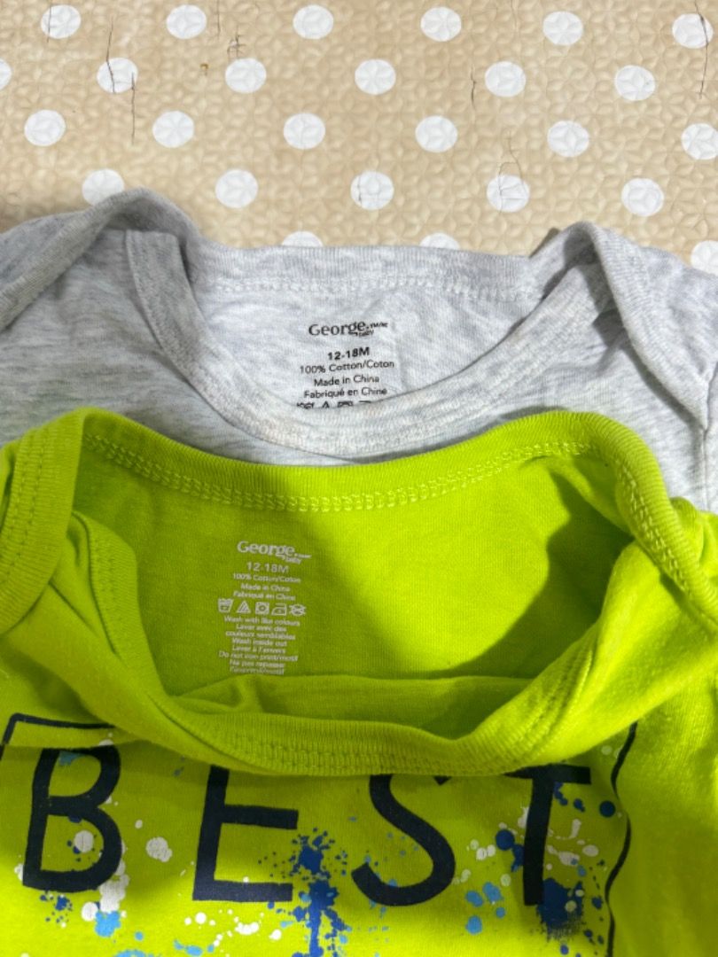 George Baby Bodysuits 12-18M (2 pcs) (Category: Babies & Kids Fashion) located in Manila. Submitted by louvemaria (Listing ID 1441489015, Image 2). Description: - Set of 2 cute baby bodysuits from George - Size: 12-18 months - Design 1: Grey with 'I LOVE MY HOME' and maple leaf graphic - Design 2: Bright green with 'BEST BRO' splatter design - Material: 100% Cotton - Ideal for everyday wear or as a thoughtful gift.