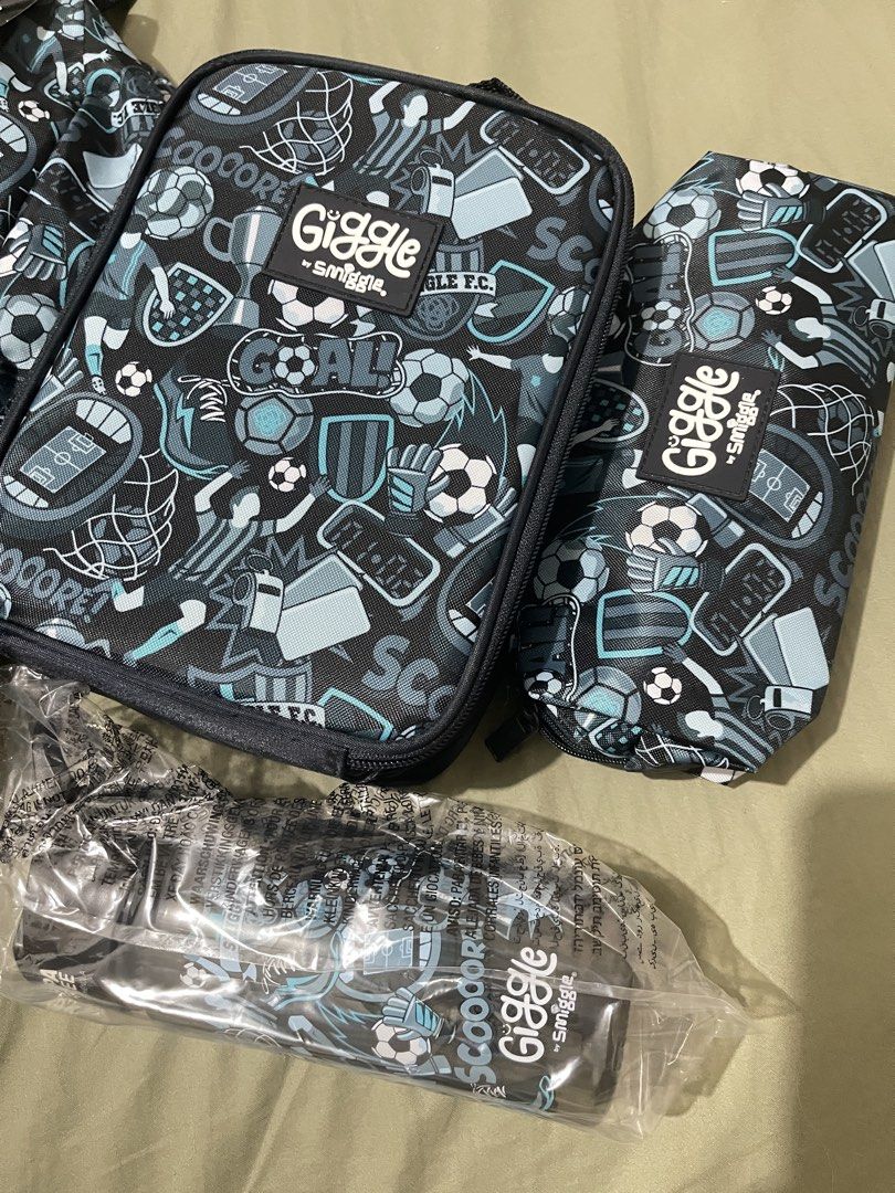 Giggle by Smiggle 4 Piece Soccer Backpack Set from Australia (Category: Babies & Kids Fashion) located in Dagupan City. Submitted by ch4rry380 (Listing ID 1441435748, Image 3). Description: Giggle by Smiggle 4-piece set from AUS - Cool soccer theme - Includes: Backpack, Lunchbox, Pencil Case, Drink Bottle - Drink Bottle Capacity: 450ml / 15 fl oz - Perfect for school or sports activities This bundle includes: * 1 x Giggle by Smiggle Backpack * 1 