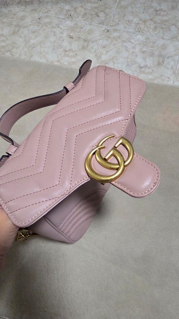 Gucci bag (Category: Luxury Bags & Wallets) located in Mandaluyong City. Submitted by deverarose (Listing ID 1441387356, Image 3). Description: - Brand: Gucci - Color: Soft Pink - Design: Quilted pattern with iconic GG logo and heart detail on the back - Strap: Gold-tone chain strap - Style: Elegant and chic women's handbag - Condition: Excellent (as shown in images).